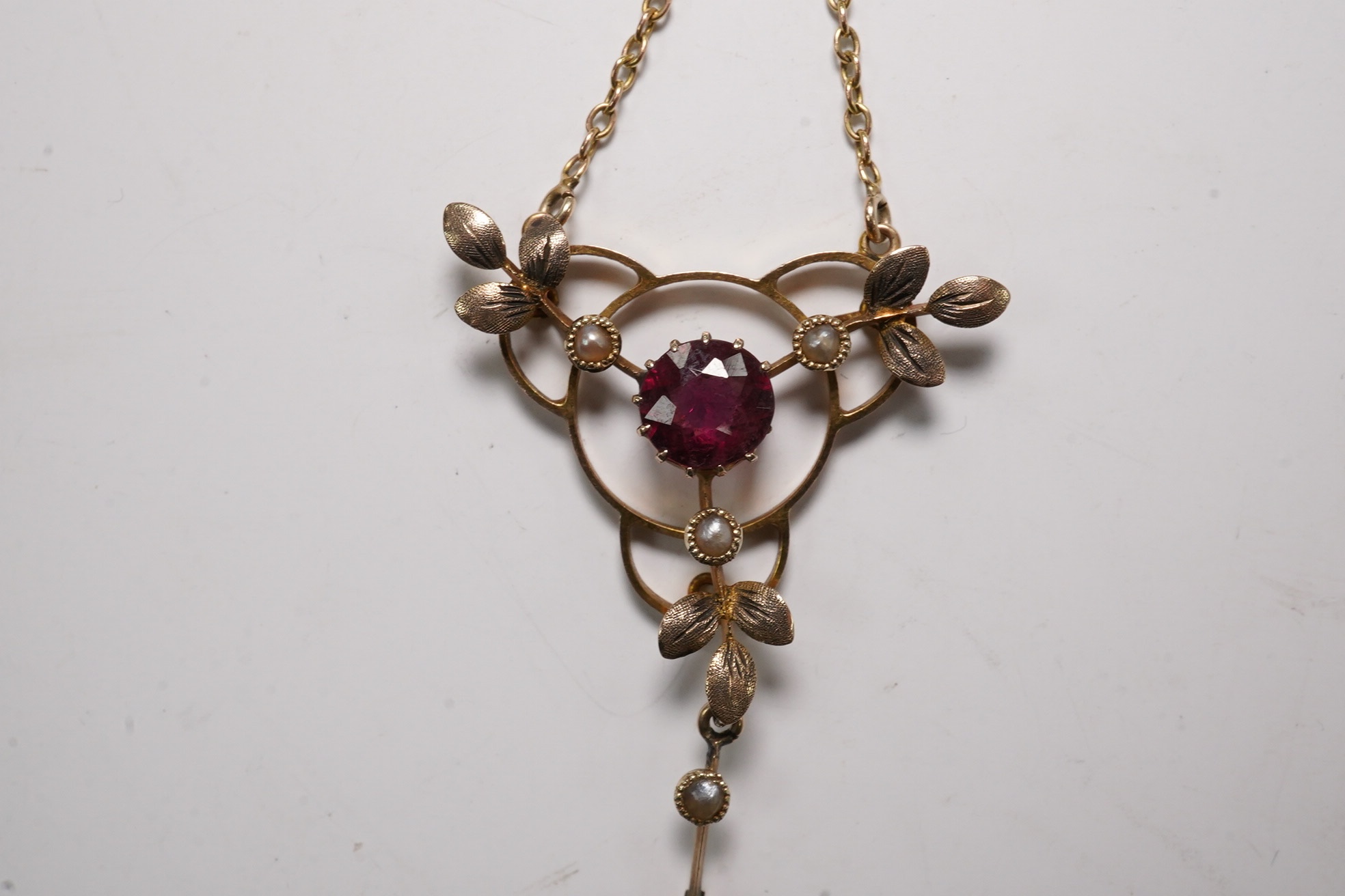 An Edwardian 9ct and gem set drop pendant necklace, pendant 43mm, chain tangled Condition - poor to fair